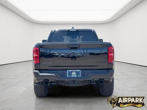 Diamond Black Crystal Pearlcoat 2026 RAM 1500 RHO Crew Cab 4x4 5'7' Box
