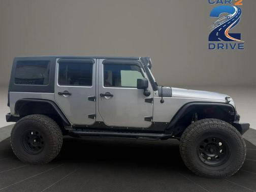 Gray 2014 Jeep Wrangler Unlimited Sahara