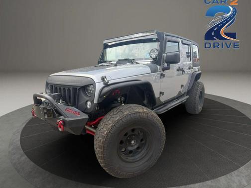Gray 2014 Jeep Wrangler Unlimited Sahara