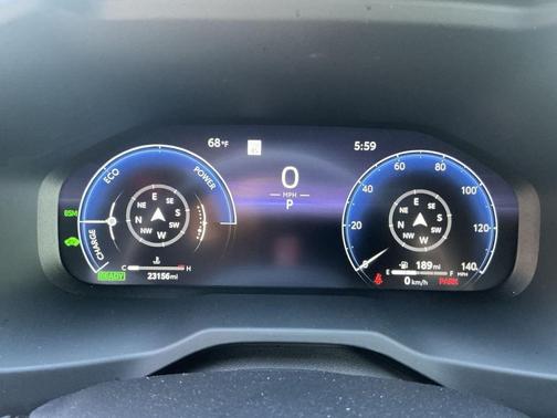Wind Chill Pearl/Midnight Black Metallic 2023 Toyota RAV4 Hybrid SE
