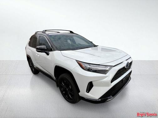 Wind Chill Pearl/Midnight Black Metallic 2024 Toyota RAV4 Hybrid SE