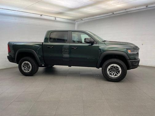 Serrano Green Metallic 2026 RAM 1500 RHO Crew Cab 4x4 5'7' Box
