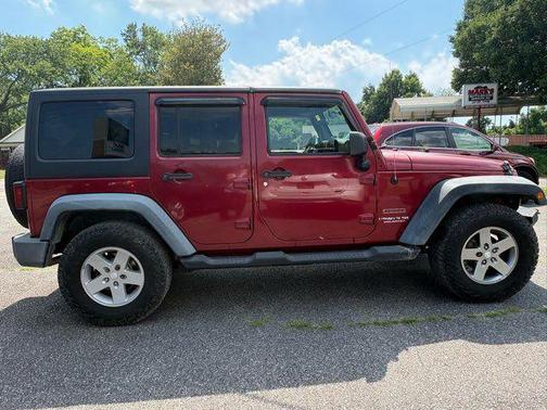 Red 2011 Jeep Wrangler Unlimited Sport