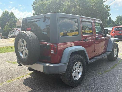 Red 2011 Jeep Wrangler Unlimited Sport