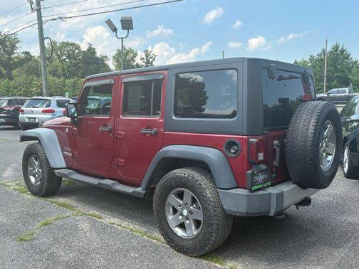 Red 2011 Jeep Wrangler Unlimited Sport