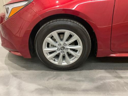 Red 2026 Toyota Corolla Hybrid LE