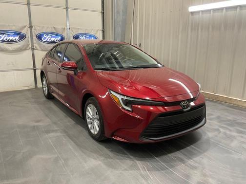 Red 2026 Toyota Corolla Hybrid LE