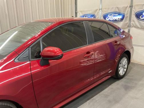 Red 2026 Toyota Corolla Hybrid LE