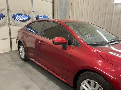 Red 2026 Toyota Corolla Hybrid LE