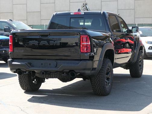 Diamond Black Crystal Pearlcoat 2026 RAM 1500 RHO Crew Cab 4x4 5'7' Box