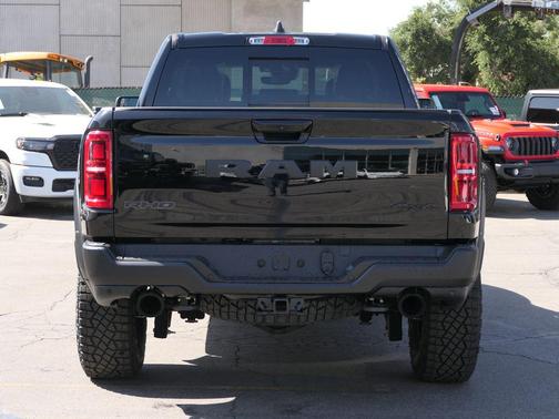 Diamond Black Crystal Pearlcoat 2026 RAM 1500 RHO Crew Cab 4x4 5'7' Box