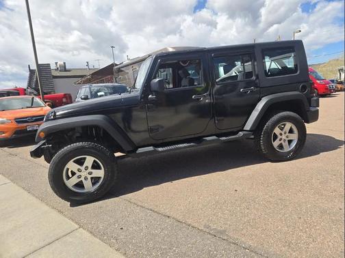 Red 2010 Jeep Wrangler Unlimited Sport