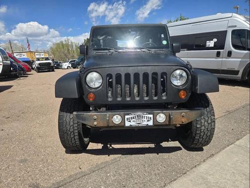 Red 2010 Jeep Wrangler Unlimited Sport