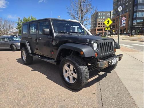 Red 2010 Jeep Wrangler Unlimited Sport