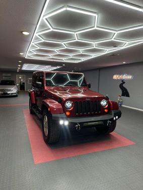 Red 2012 Jeep Wrangler Unlimited Sahara