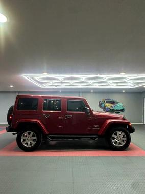 Red 2012 Jeep Wrangler Unlimited Sahara
