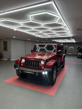Red 2012 Jeep Wrangler Unlimited Sahara