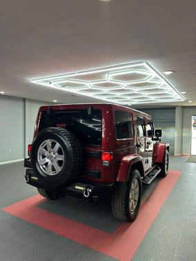 Red 2012 Jeep Wrangler Unlimited Sahara