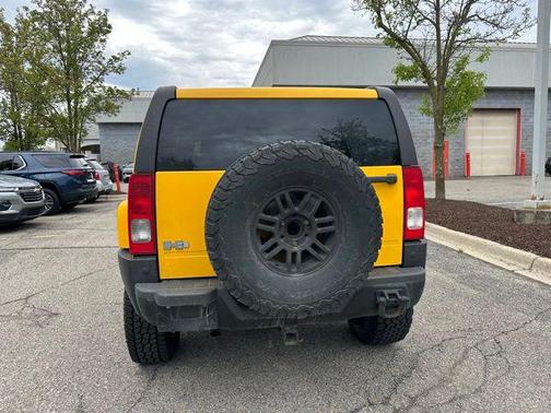 Yellow 2007 Hummer H3 Base