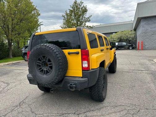 Yellow 2007 Hummer H3 Base