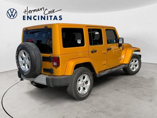 Orange 2014 Jeep Wrangler Unlimited Sahara