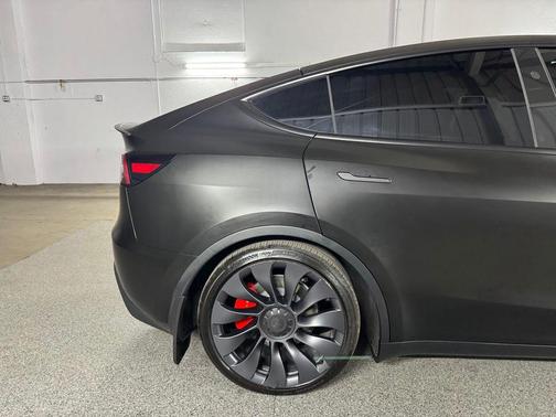 Solid Black 2024 Tesla Model Y Performance