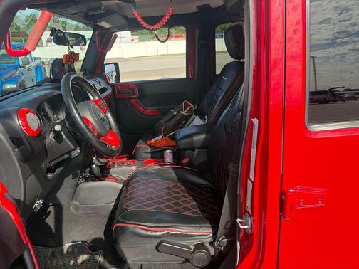 Red 2011 Jeep Wrangler Unlimited Sahara