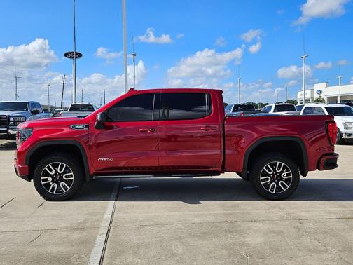 Volcanic Red Tintcoat 2025 GMC Sierra 1500 AT4