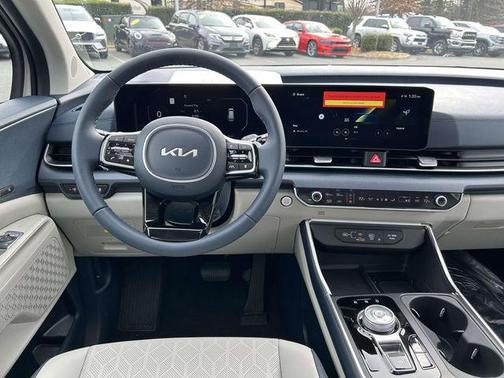 Ivory Silver 2026 Kia Carnival Hybrid SX