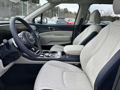 Ivory Silver 2026 Kia Carnival Hybrid SX