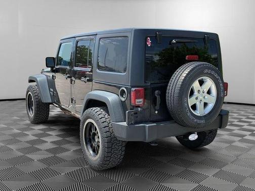 Black 2014 Jeep Wrangler Unlimited Sport
