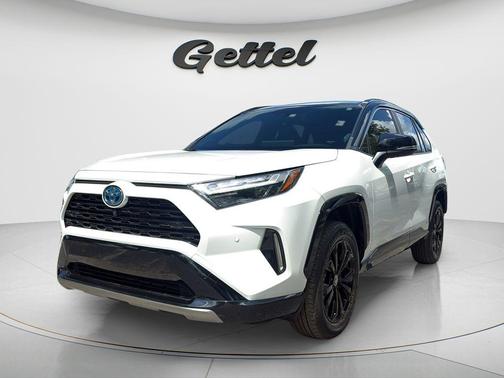 Wind Chill Pearl/Midnight Black Metallic 2024 Toyota RAV4 Hybrid SE