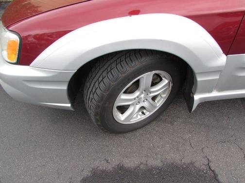 Maroon 2003 Subaru Baja Sport