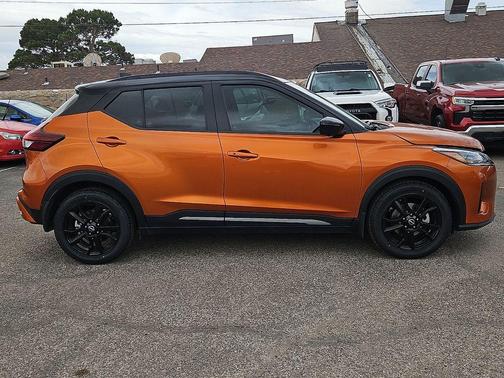 Monarch Orange / Super Black 2023 Nissan Kicks SR