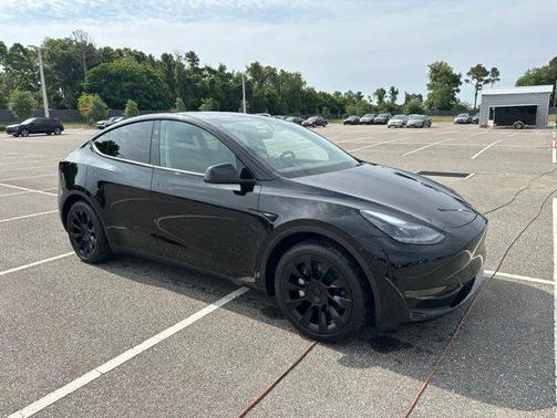 Solid Black 2025 Tesla Model Y Long Range Dual Motor Rear-Wheel Drive