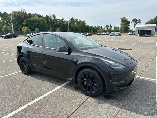 Solid Black 2025 Tesla Model Y Long Range Dual Motor Rear-Wheel Drive