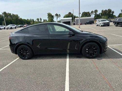 Solid Black 2025 Tesla Model Y Long Range Dual Motor Rear-Wheel Drive