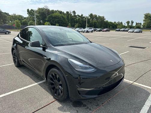 Solid Black 2025 Tesla Model Y Long Range Dual Motor Rear-Wheel Drive