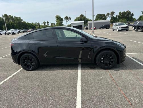 Solid Black 2025 Tesla Model Y Long Range Dual Motor Rear-Wheel Drive