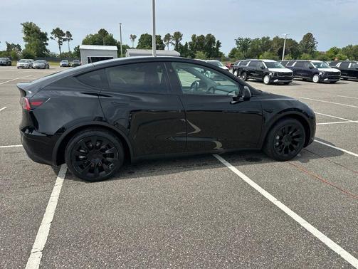 Solid Black 2025 Tesla Model Y Long Range Dual Motor Rear-Wheel Drive
