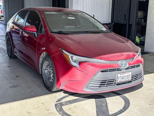 Ruby Flare Pearl 2025 Toyota Corolla Hybrid LE
