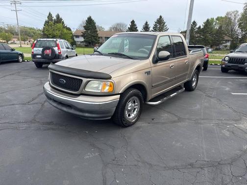 Tan 2002 Ford F-150 Lariat SuperCrew