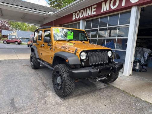 Orange 2014 Jeep Wrangler Unlimited Willys Wheeler Edition 4x4 4dr SUV