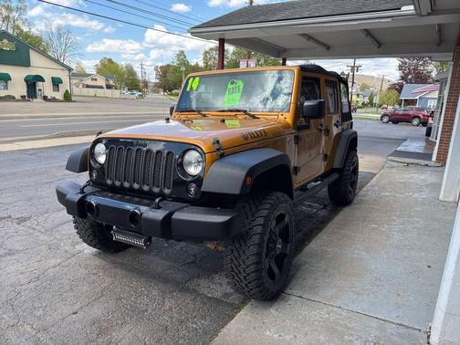 Orange 2014 Jeep Wrangler Unlimited Willys Wheeler Edition 4x4 4dr SUV