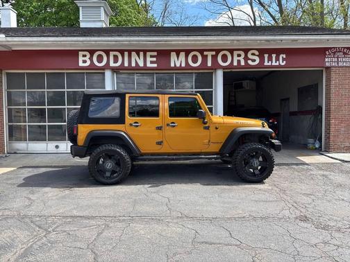 Orange 2014 Jeep Wrangler Unlimited Willys Wheeler Edition 4x4 4dr SUV