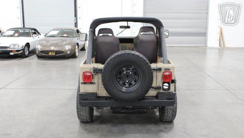 Tan 1983 Jeep CJ-7
