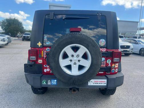 Red 2010 Jeep Wrangler Unlimited Sport