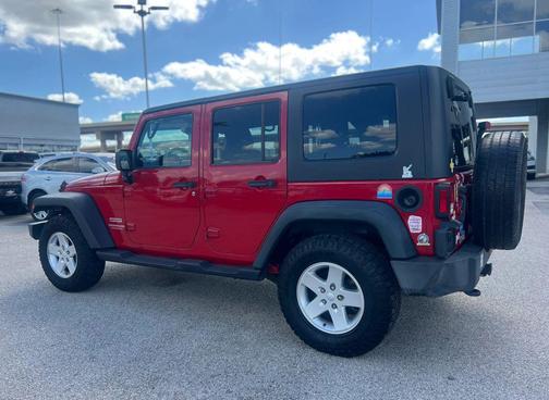 Red 2010 Jeep Wrangler Unlimited Sport
