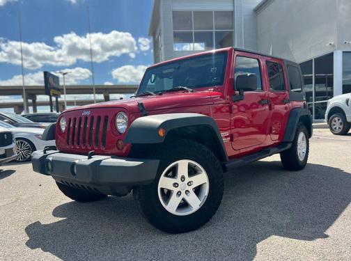 Red 2010 Jeep Wrangler Unlimited Sport