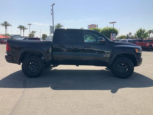 Diamond Black Crystal Pearlcoat 2026 RAM 1500 RHO Crew Cab 4x4 5'7' Box